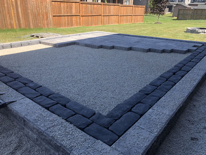 Raised paver patio w. border. A raised patio project by the London Ontario based O'Connor Stone & Landscape.