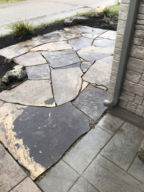 Random flagstone patio. A stone patio project in London Ontario region by O'Connor Stone & Landscape.