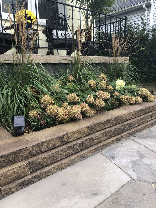 Engineered retaining wall. A retaining wall project in London Ontario region by O'Connor Stone & Landscape, landscape and hardscape contractor.