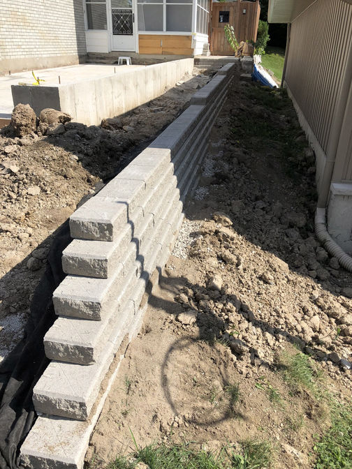Engineered retaining wall. A retaining wall project by the London Ontario based O'Connor Stone & Landscape