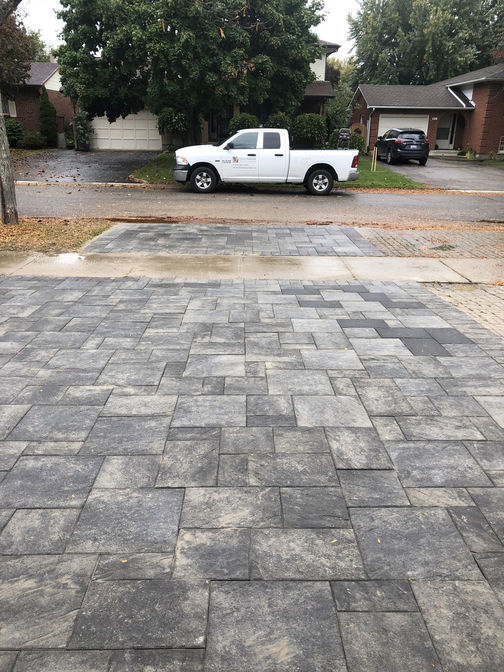 Interlocking brick driveway. An interlocking brick paver driveway project in London Ontario region by O'Connor Stone & Landscape, your paved driveway contractor.