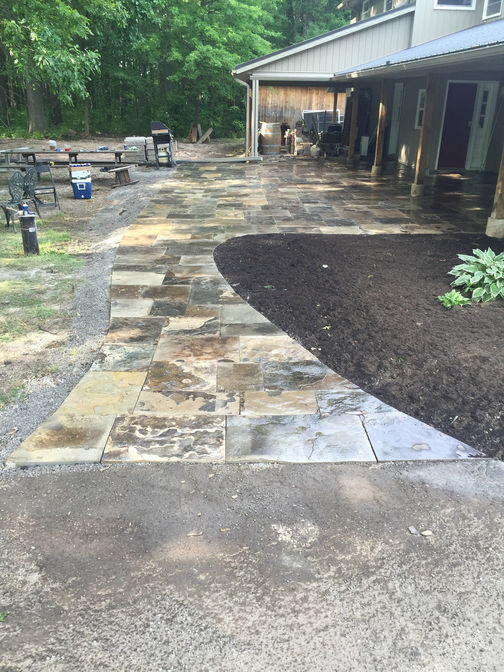 Square cut flagstone patio & walkway. A stone patio project in London Ontario region by O'Connor Stone & Landscape.