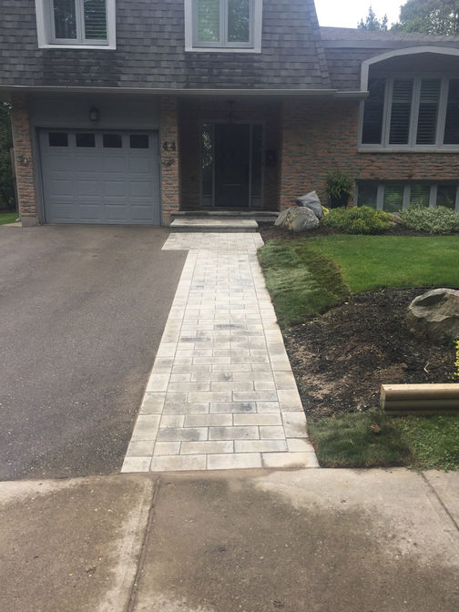 Driveway extension and paver walkway. A paver project in London Ontario region by O'Connor Stone & Landscape.
