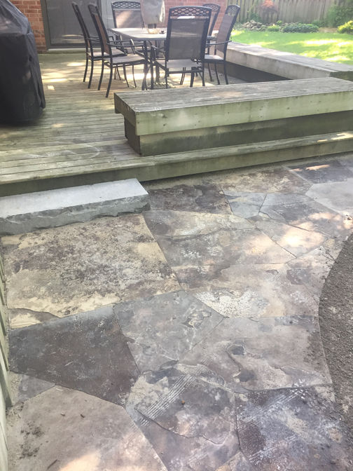 Natural rock-faced stone step. Stone steps or faux stone steps project by the London Ontario based O'Connor Stone & Landscape