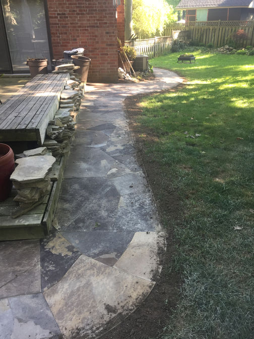 Custom cut random flagstone walkway. A custom cut stone walkway project by O'Connor Stone & Landscape.