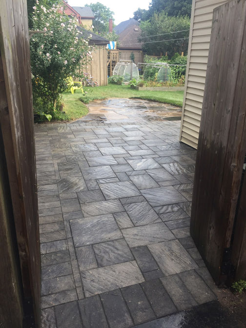 Square flagstone walkway. A walkway project by O'Connor Stone & Landscape.