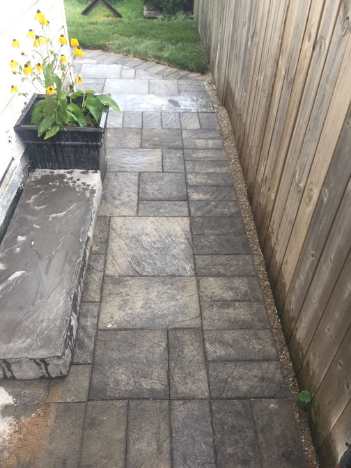 Paver walkway with faux stone step. A stone paver walkway project by the London Ontario based O'Connor Stone & Landscape.