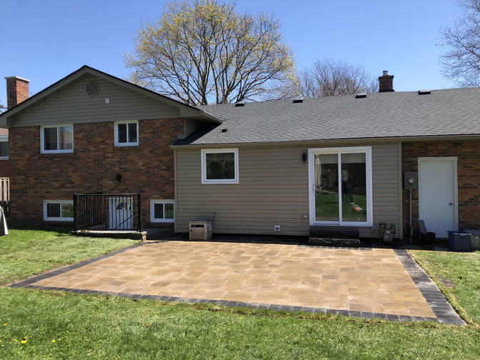 Interlock paver patio with border. A stone patio project in London Ontario region by O'Connor Stone & Landscape.