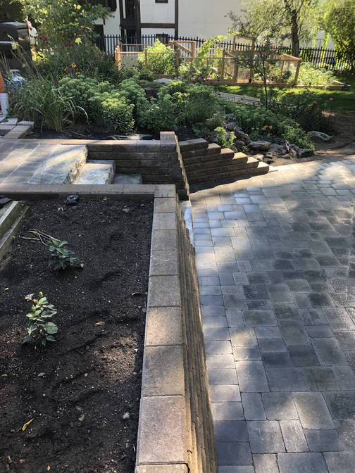 Engineered retaining wall. A retaining wall project by the London Ontario based O'Connor Stone & Landscape