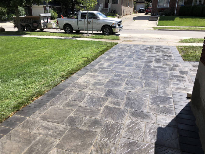 Interlock paver driveway. An interlocking paver driveway project in London Ontario region by O'Connor Stone & Landscape.