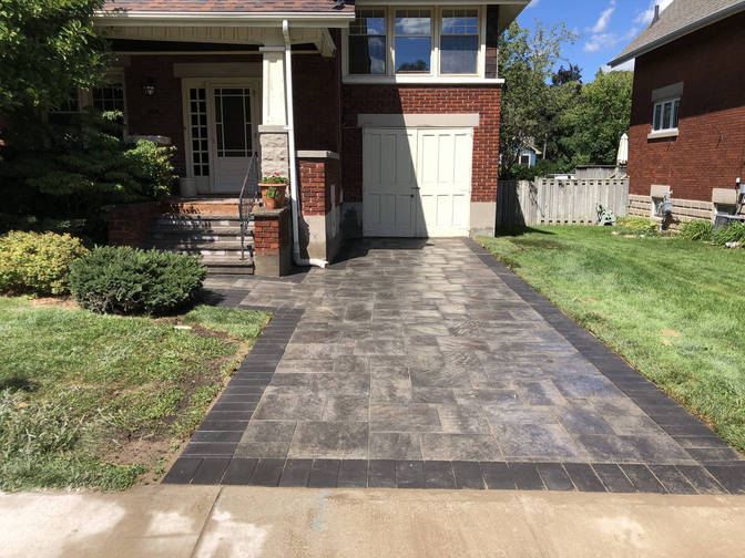 Mortared flagstone steps and paver driveway. A stone steps and paver driveway project by the London Ontario based O'Connor Stone & Landscape