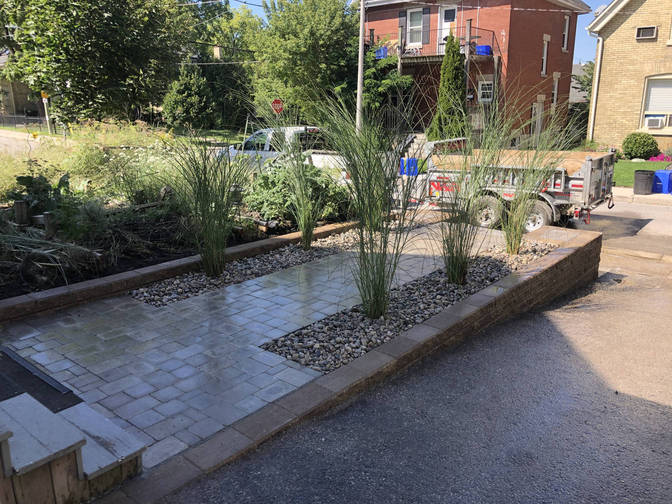 Engineered retaining wall & Stone Paver Walkway. A retaining wall project by the London Ontario based O'Connor Stone & Landscape