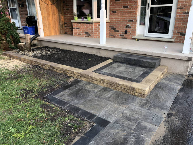 Faux stone step and paver landing. A project by the London Ontario based O'Connor Stone & Landscape