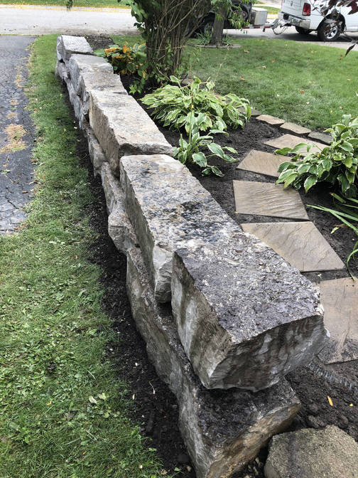 Armour stone wall. A project by the London Ontario based O'Connor Stone & Landscape